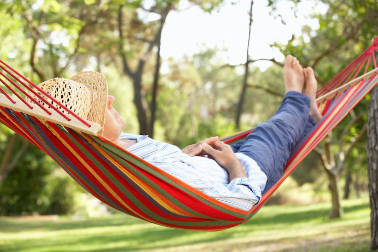 Man lazing in a hammock