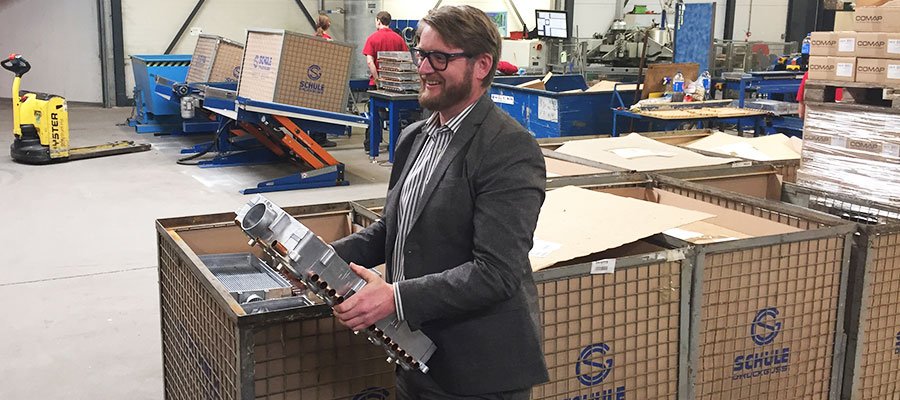 Ralf Jansen of Intergas at the factory displaying a boiler part